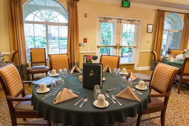 A neatly arranged dining table in an elegant restaurant setting.