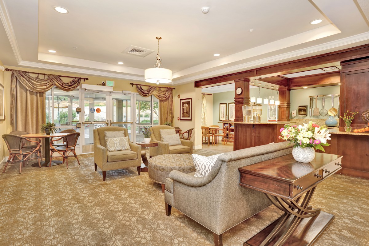 A cozy living room interior with comfortable seating and elegant decor.