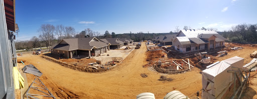 A view of a residential construction site with multiple houses under development.