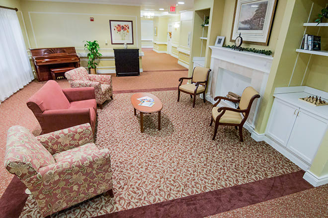 A comfortable lobby area with seating and a piano.