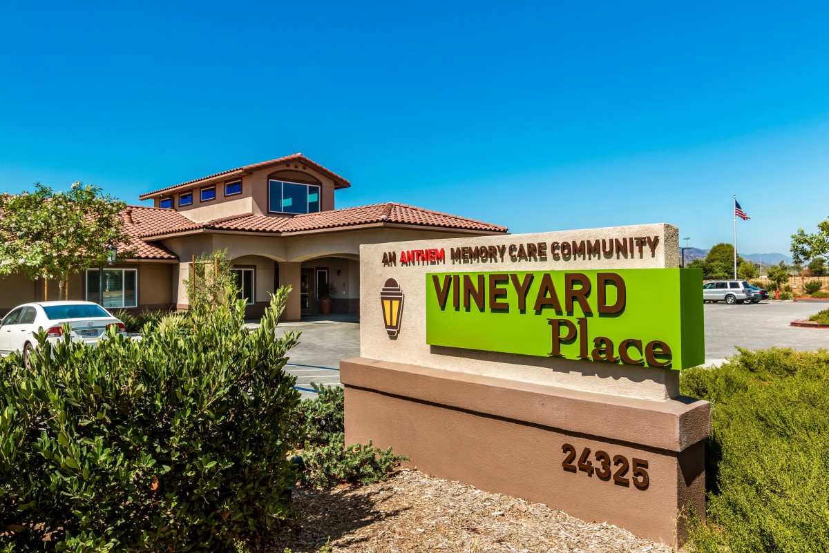 The exterior of Vineyard Place, a memory care community, on a bright sunny day.