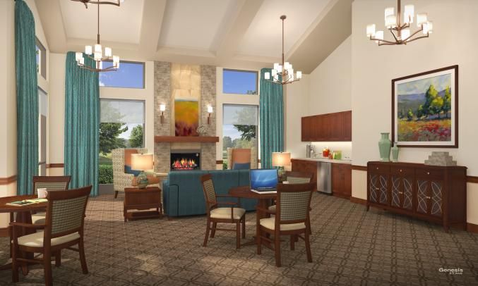 A modern living room with a fireplace and dining table, featuring elegant chandeliers and large windows.