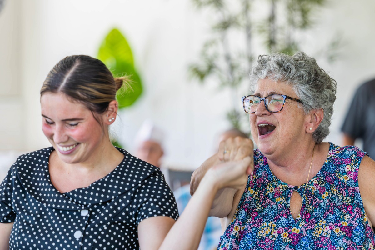 Two people joyfully sharing a moment of laughter.