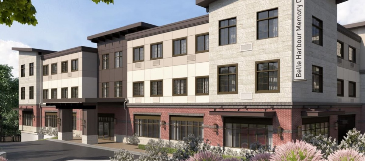 A modern multi-story building with a detailed facade and multiple windows, likely a commercial property.