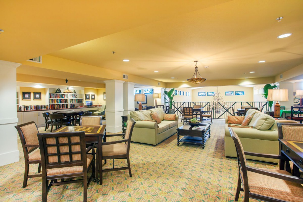 A cozy lounge with comfortable seating and warm lighting.