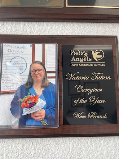 Victoria Tatum honored as Campaigner of the Year with a beautiful bouquet.