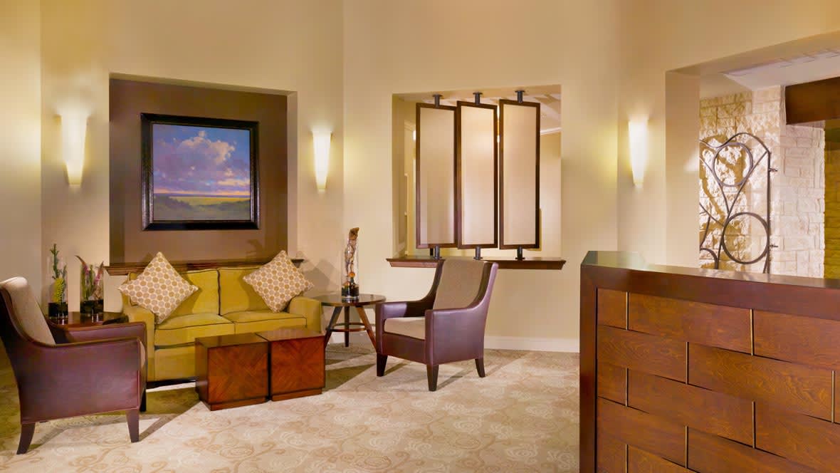 A cozy living room featuring a comfortable sofa, armchair, and stylish decor.