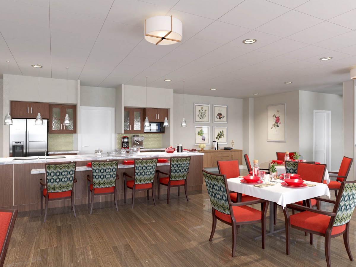 A modern kitchen and dining area featuring a sleek design with red chairs and bar stools, wood flooring, and an open layout.