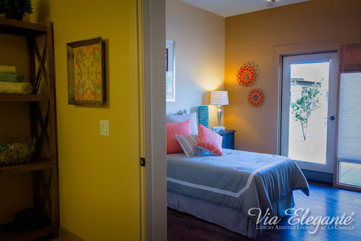 A cozy and colorful bedroom showcasing modern decor and inviting natural light.