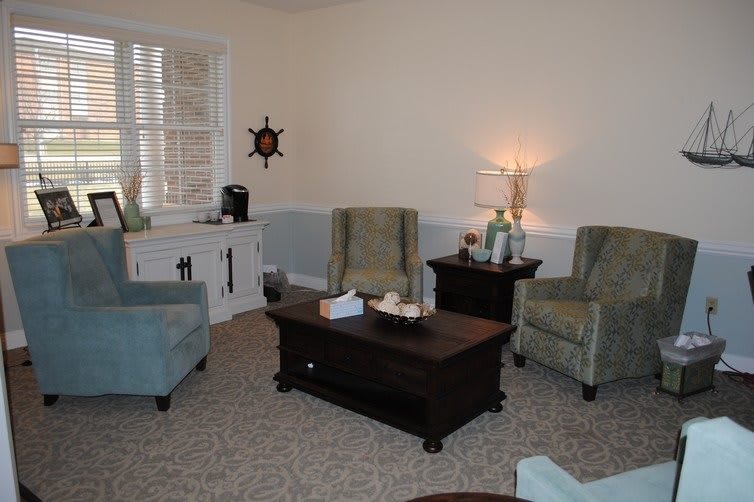 A cozy living room with comfortable chairs and a coffee table.
