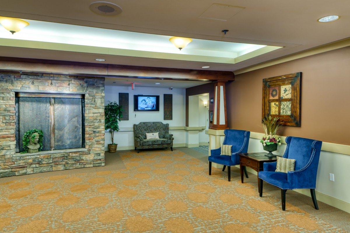 A well-furnished lobby with comfortable seating, artwork, and decorative elements.