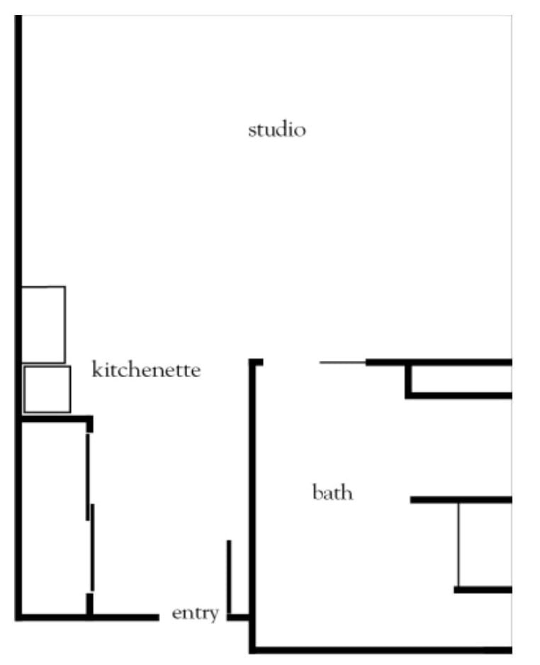 A floor plan of a studio apartment featuring a kitchenette and a bathroom.