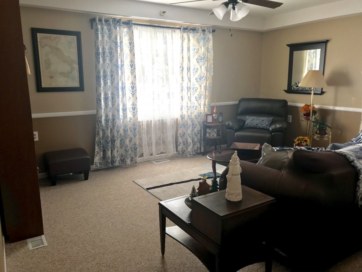 A cozy living room with comfortable furniture and natural light.