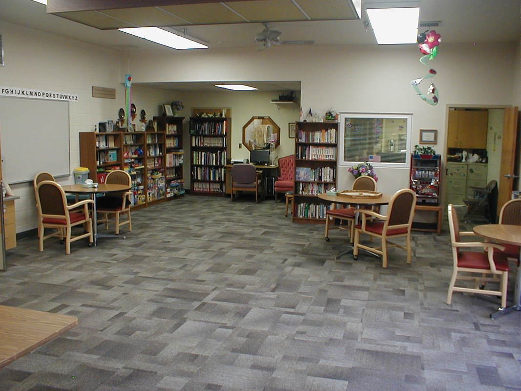 A cozy library space with bookshelves and seating.