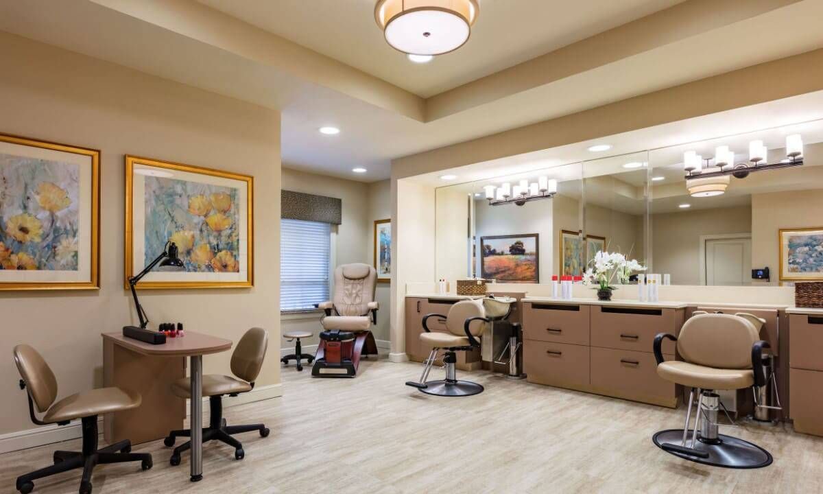 A well-lit beauty salon with comfortable chairs and stylish decor.