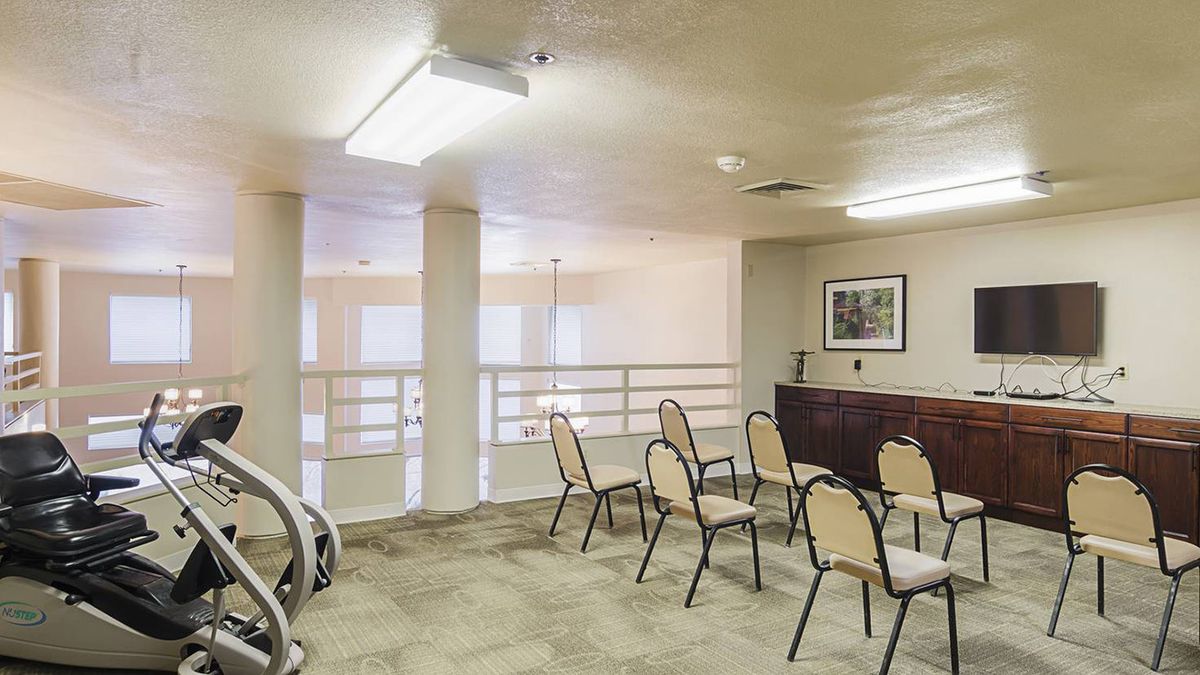 A small conference room with chairs arranged for a meeting.