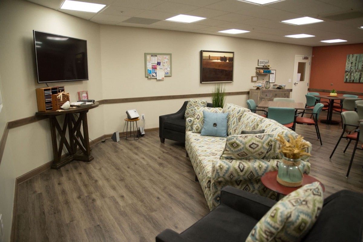 A cozy waiting room with comfortable seating and modern decor.