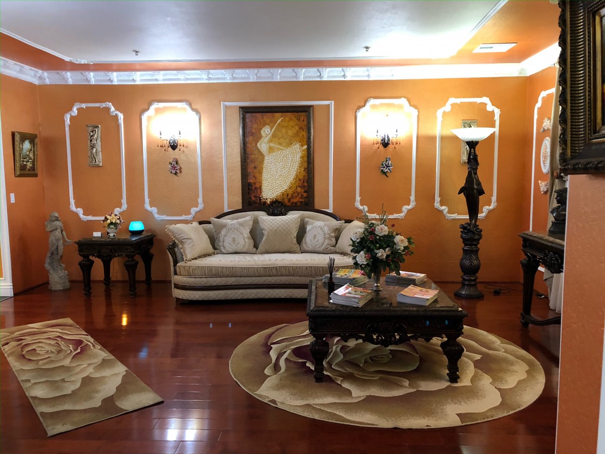A traditional living room with ornate decorations and warm lighting.