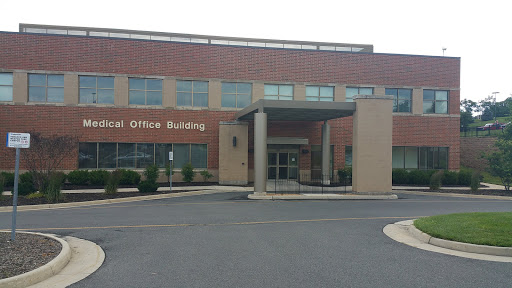 A view of a modern office building with a prominent entrance.