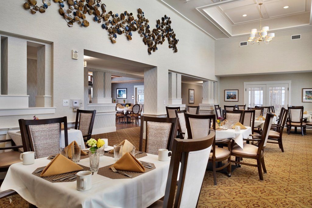 An elegant dining room with neatly set tables and stylish decor.