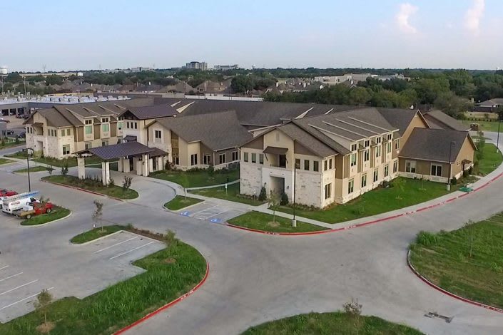 Aerial view of a residential complex in a suburban area.