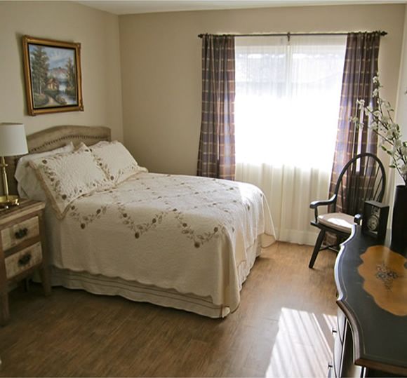 Cozy bedroom with classic decor and natural light.