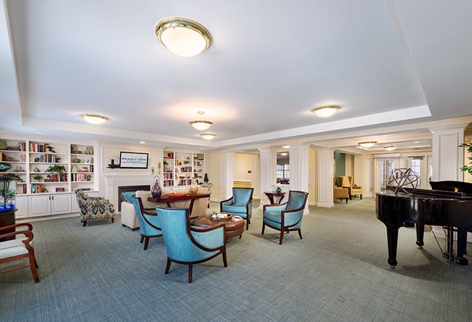A spacious and well-lit lounge area with comfortable seating and elegant decor.