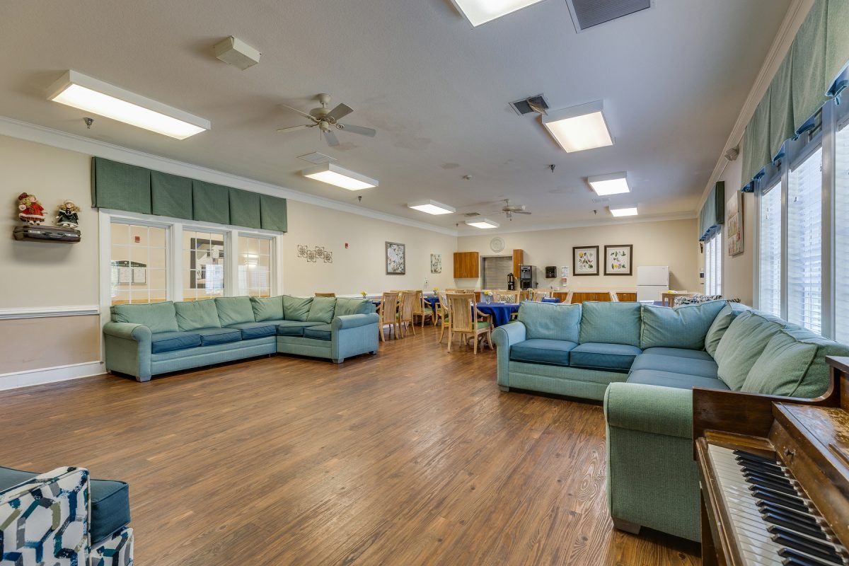Spacious living area with comfortable couches and ample lighting.