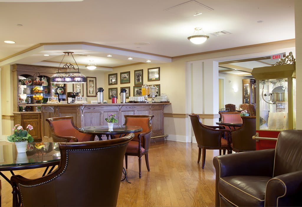 A cozy lounge area with comfortable seating and a well-stocked bar.