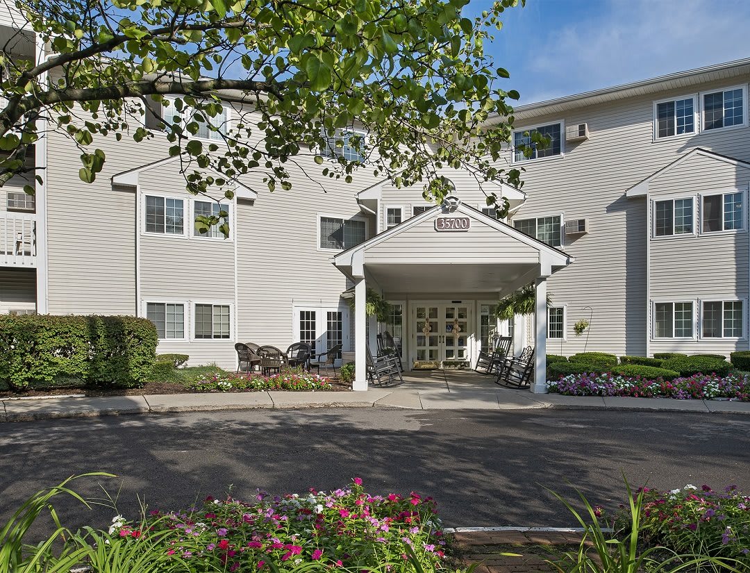 A residential building with a welcoming entrance and landscaped surroundings.