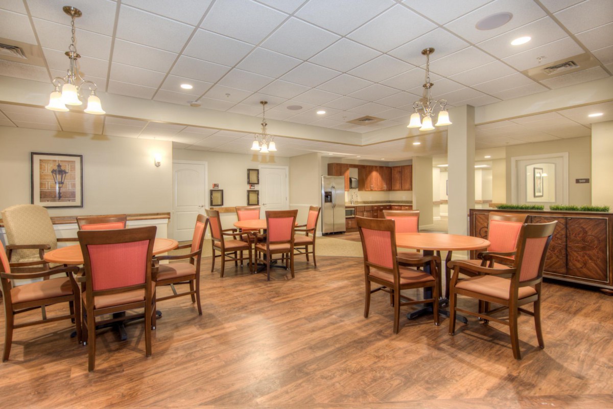A cozy dining area with wooden floors and comfortable seating.