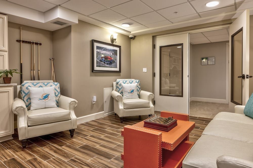 A cozy, modern living room with comfortable chairs and stylish decor.