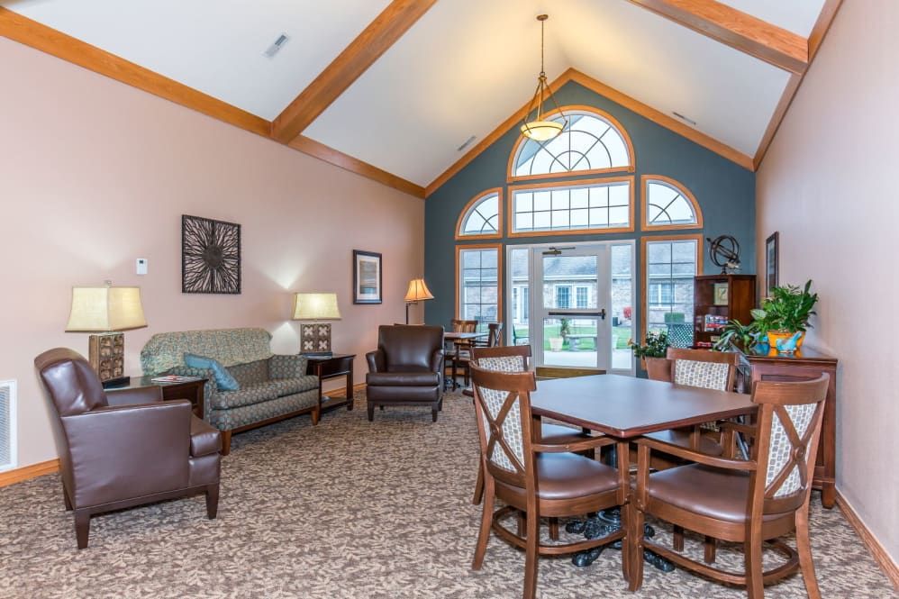 A cozy living room with comfortable seating and large windows.