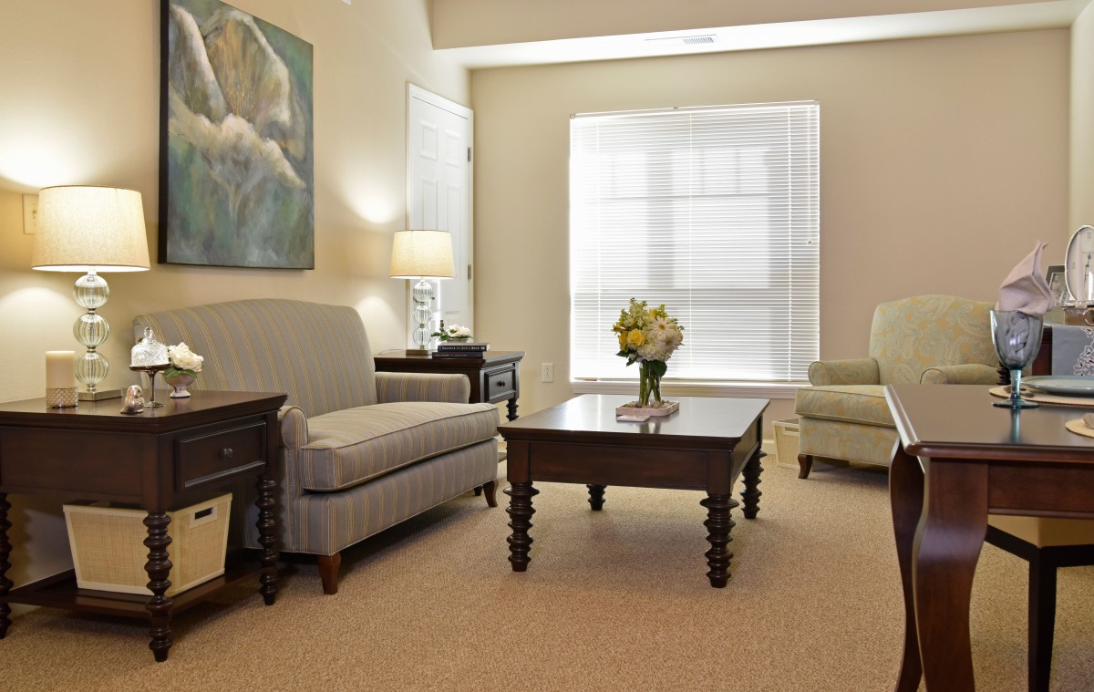 A cozy living room with comfortable seating and elegant decor.