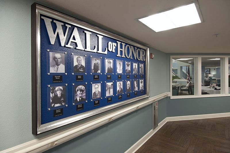 A Wall of Honor featuring portraits and names to commemorate individuals.