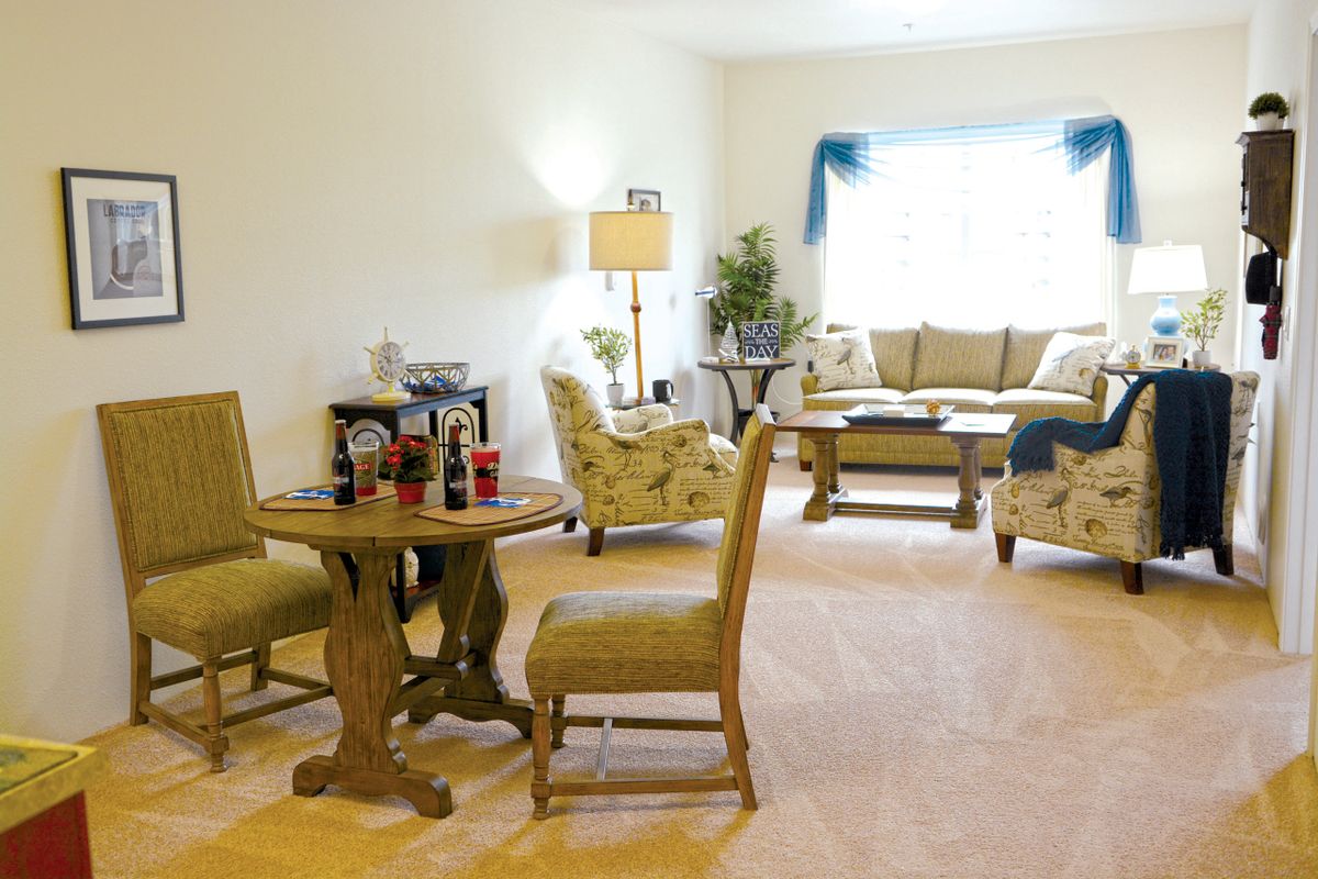 A cozy living room with elegant furniture and decor.