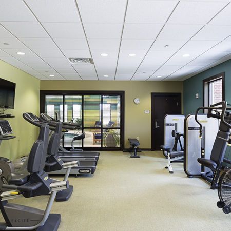 A modern gym equipped with treadmills and various exercise machines.