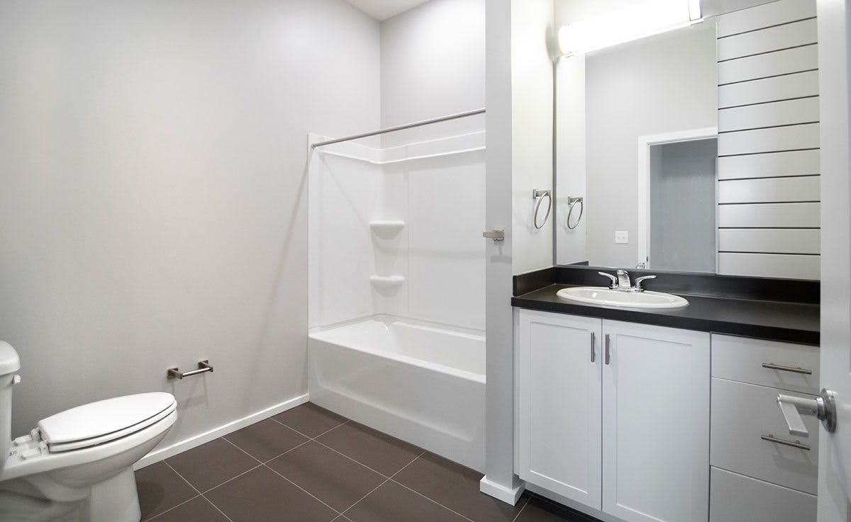 Modern bathroom with bathtub and vanity
