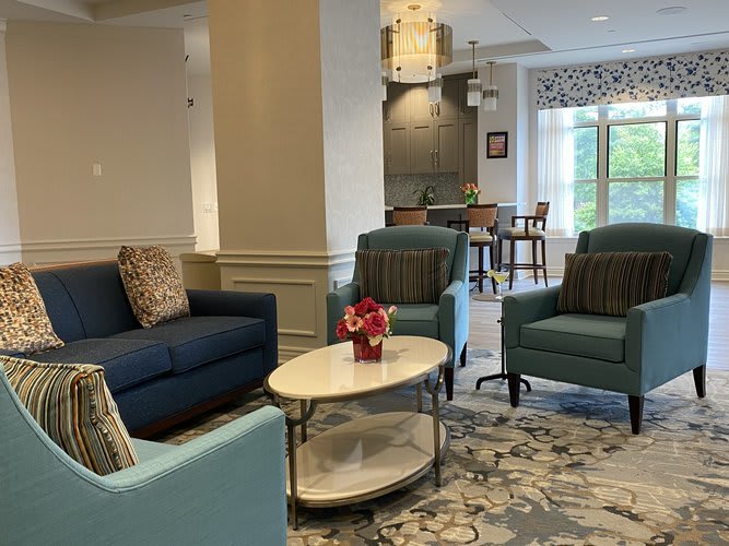 A cozy living room setting with comfortable seating and tasteful decor.