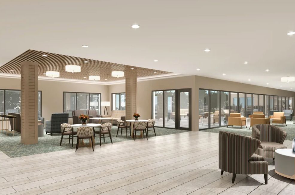 A modern and spacious interior with ample seating and natural lighting.