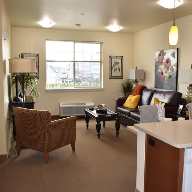 A cozy and well-furnished living room with comfortable seating and stylish decor.