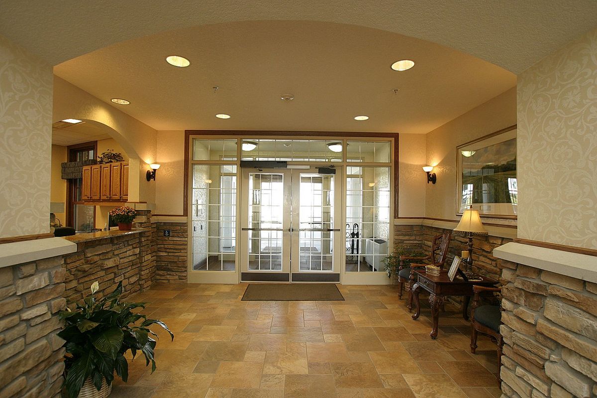 A welcoming lobby with stone accents and ample lighting.