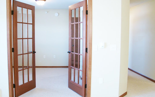 A view of an interior space featuring elegant French doors.