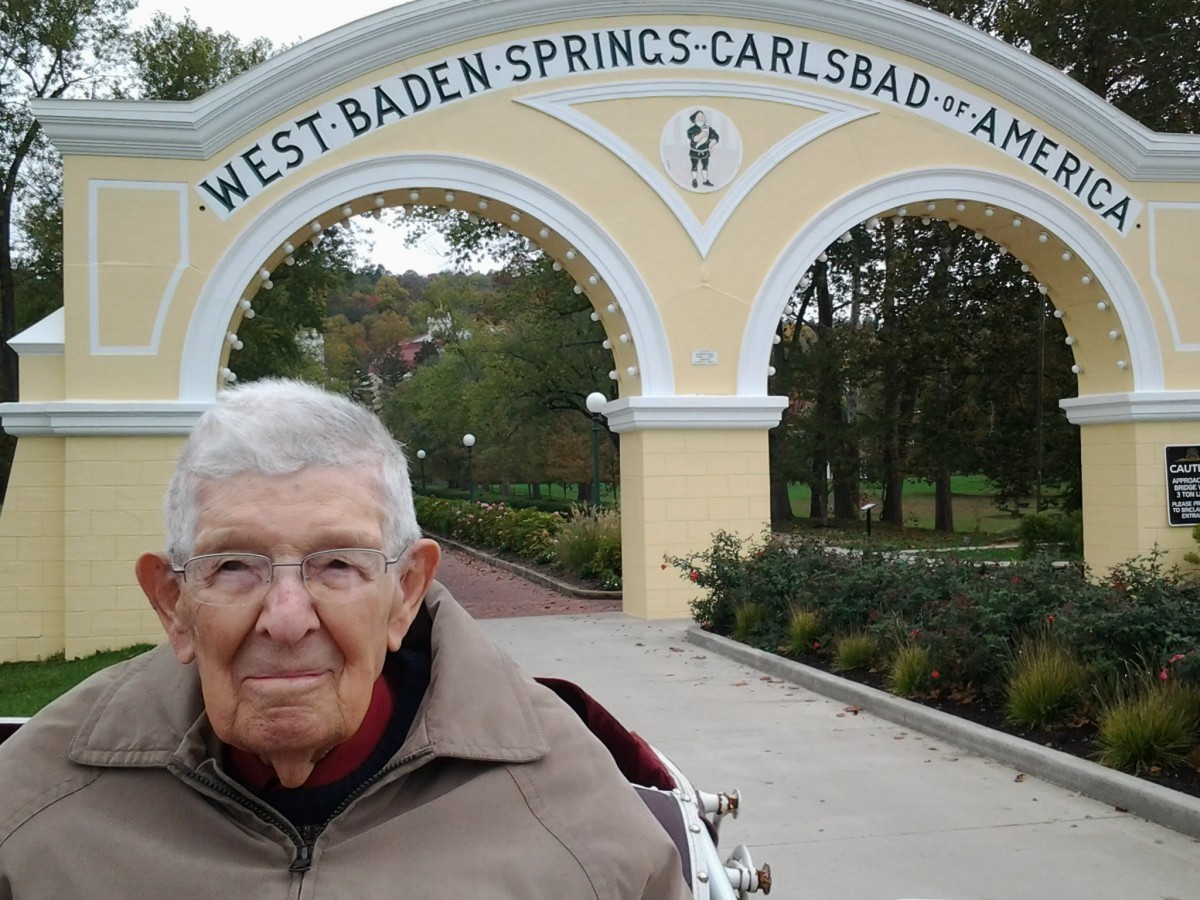 An elderly man in front of the West Baden Springs archway.