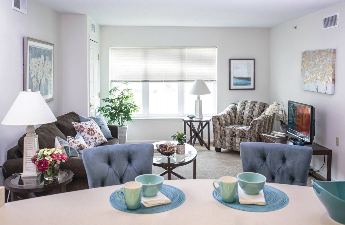 A cozy and modern living room with stylish furnishings and natural light.