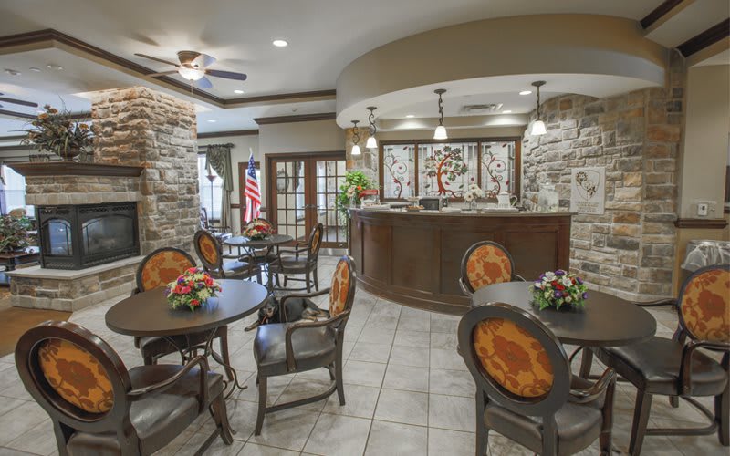 A cozy dining area featuring stone walls and elegant decor.