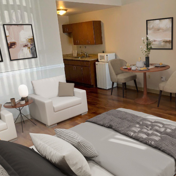 A cozy studio apartment with modern decor, featuring a living area, bedroom space, and kitchenette.