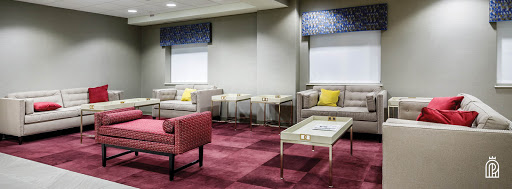 A modern lounge area featuring comfortable seating and stylish decor.