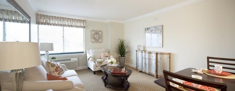 A cozy and bright living room with traditional style furniture and decor.