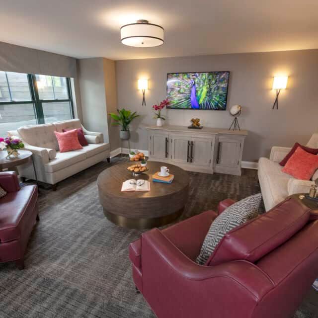 A modern living room with stylish furniture and vibrant decor.
